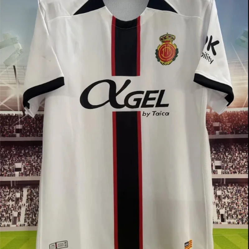 Yellow Soccer Jersey: Black Accents, V-Neck & Emblem