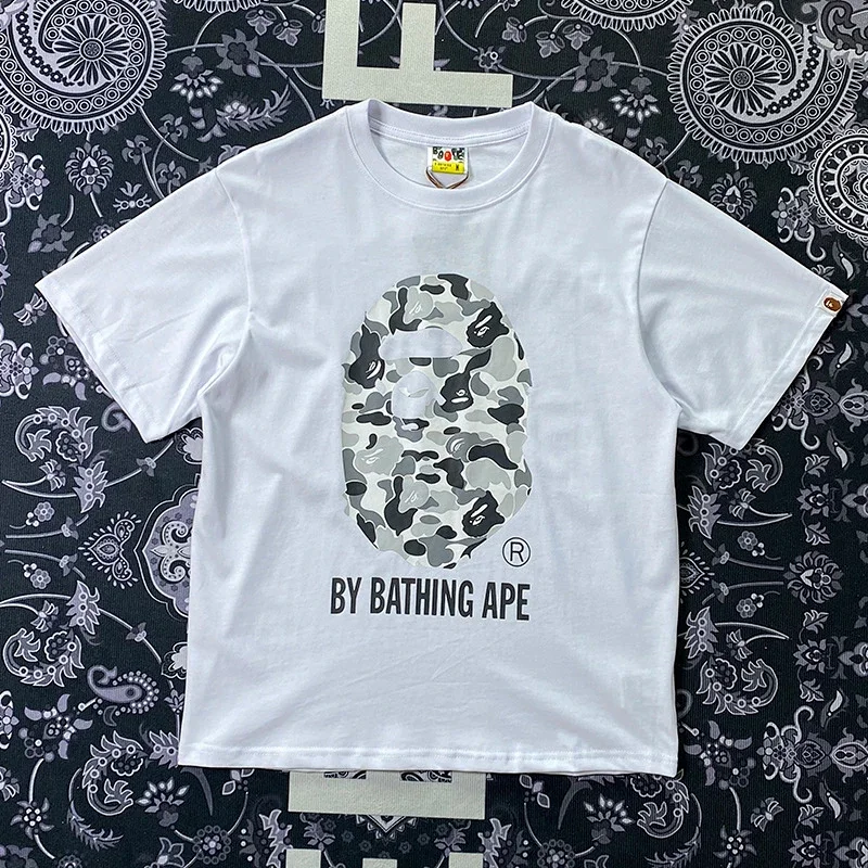 BAPE White T - Shirt with Camouflage Ape Head & "BY BATHING APE" Text