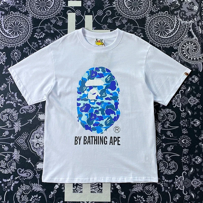 BAPE White T - Shirt with Blue Camouflage Ape Head Graphic and "BY BATHING APE" Text