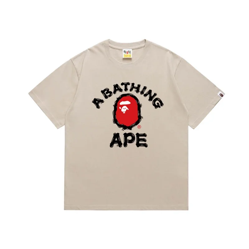 A BATHING APE Beige T - Shirt with Red Ape Head Logo and Black "A BATHING APE" Text